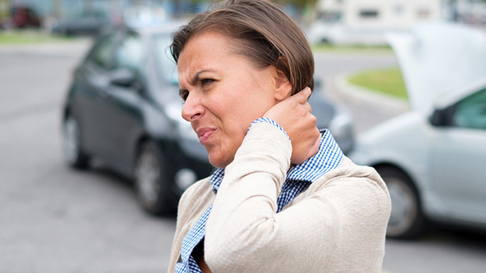 Woman with neck pain from auto injury